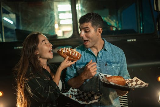 A Couple Eating Near the Food Truck